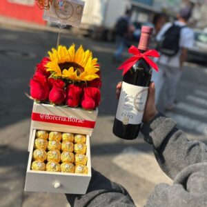 caja con rosas girasol y chocolates mas vino