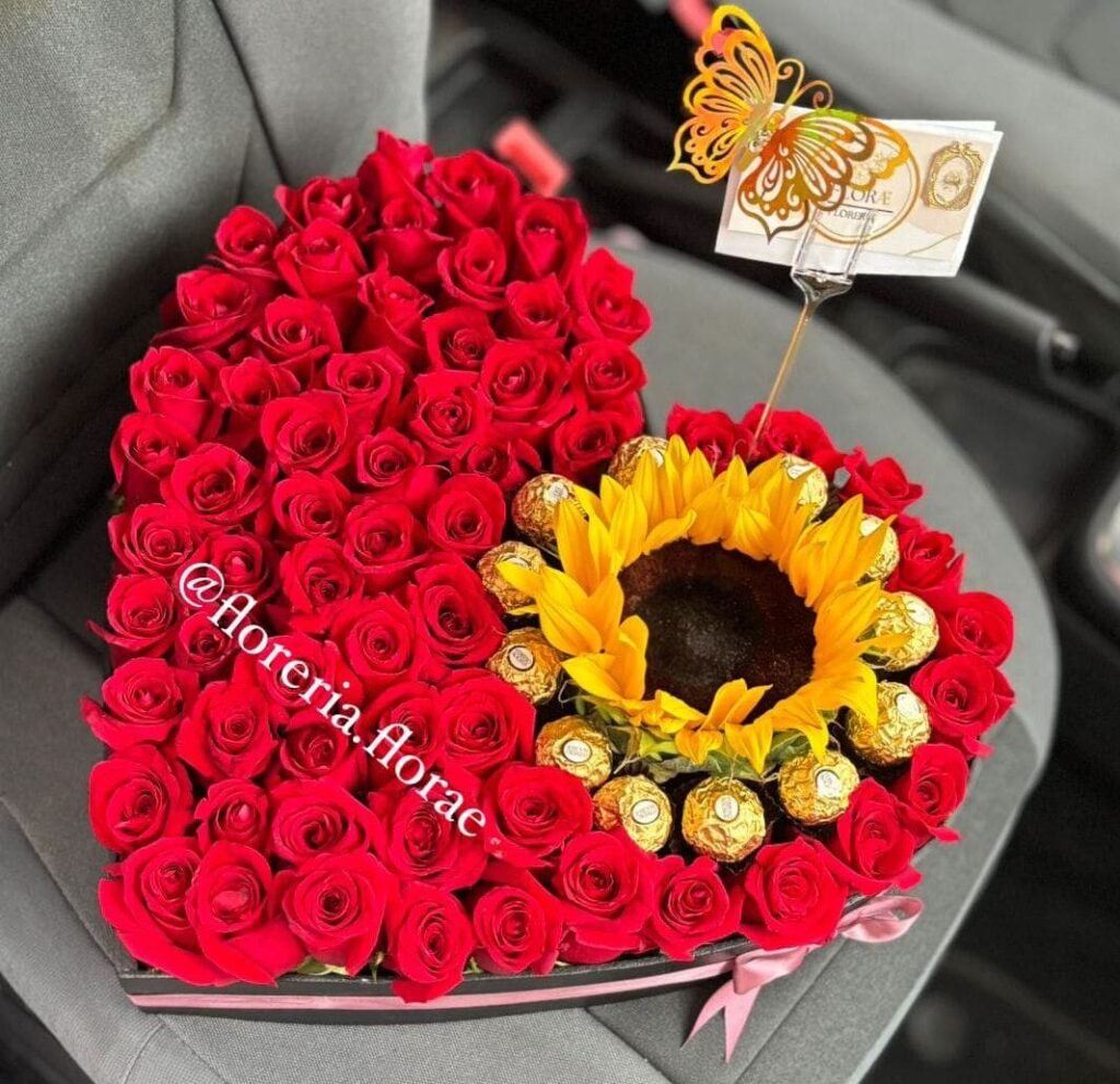 caja con rosas girasol y chocolates
